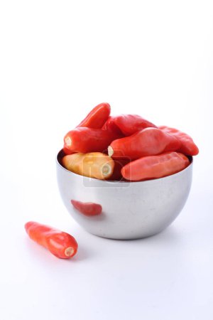 Photo for Chili pepper in a white dish on a table - Royalty Free Image