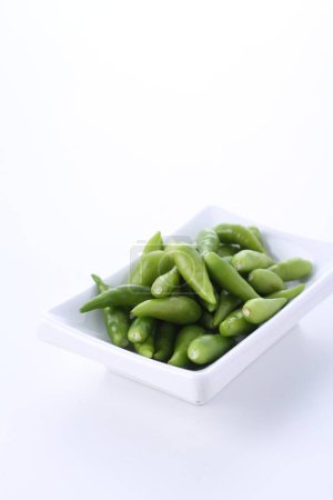Photo for Green beans in a bowl on white background - Royalty Free Image