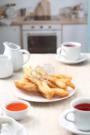 Photo for Cakwe is one of the traditional Chinese confectionary. Cakwe is a Hokkien dialect meaning fried ghost, The name is closely related to the origin of this small but historically loaded confectionery. - Royalty Free Image