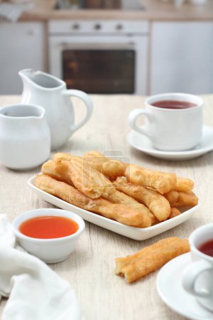 Photo for Cakwe is one of the traditional Chinese confectionary. Cakwe is a Hokkien dialect meaning fried ghost, The name is closely related to the origin of this small but historically loaded confectionery. - Royalty Free Image