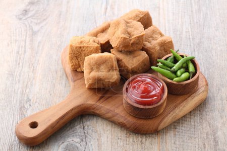 Photo for Tasty chicken nuggets with sauce on wooden background - Royalty Free Image