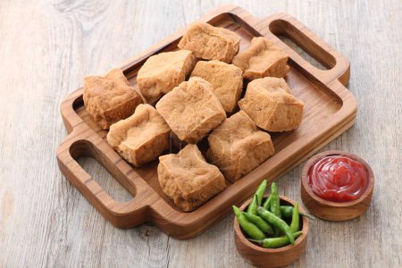Photo for Homemade chicken nuggets with sauce and cheese on wooden background - Royalty Free Image
