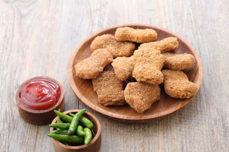 Photo for Fried chicken nuggets with sauce on wooden background - Royalty Free Image