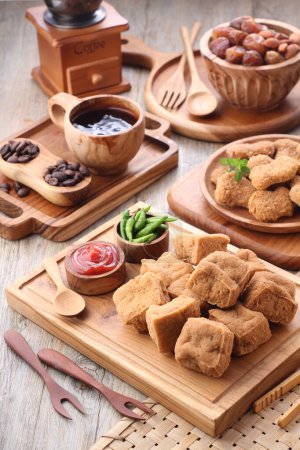 Photo for Delicious food. fried tofu and spices on wooden background. selective focus. - Royalty Free Image