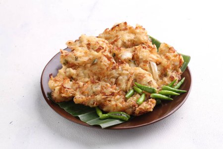 Bakwan is a fried food made from vegetables and wheat flour that is commonly found in Indonesia. Bakwan usually refers to fried snacks of vegetables that are usually sold by traveling hawkers.