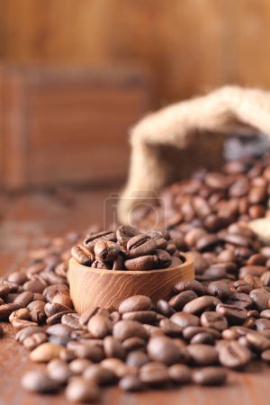 Photo for A coffee bean is a seed of the Coffea plant and the source for coffee. It is the pip inside the red or purple fruit. This fruit is often referred to as a coffee cherry. - Royalty Free Image