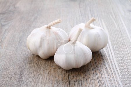 Photo for Garlic on wooden board. close up view - Royalty Free Image