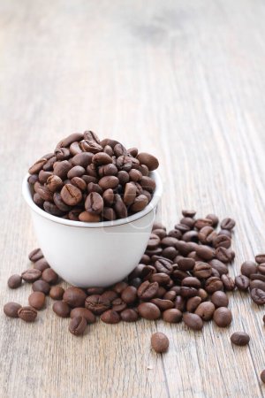 Photo for Roasted coffee beans on wooden background. - Royalty Free Image