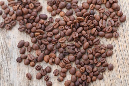 Photo for Coffee beans with a wooden background - Royalty Free Image