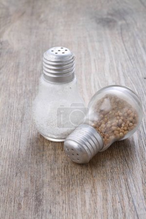 Photo for Salt shaker on wooden background - Royalty Free Image