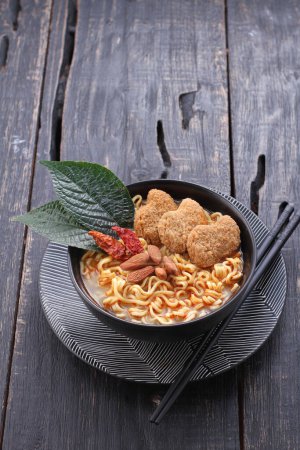 Photo for Boiled noodles with vegetables, nuggets and spicy seasonings - Royalty Free Image