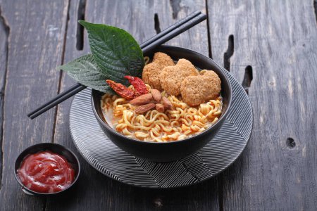 Photo for Boiled noodles with vegetables, nuggets and spicy seasonings - Royalty Free Image