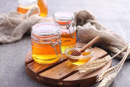 Pure honey in a glass jar