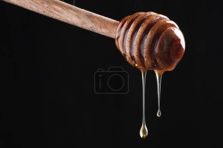 Téléchargez les photos : Miel pur dans un bocal en verre - en image libre de droit