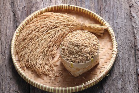 Photo for Dry rice in a wooden bowl - Royalty Free Image