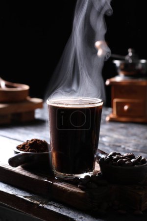Photo for Coffee is a beverage prepared from roasted coffee beans. Darkly colored, bitter, and slightly acidic, coffee has a stimulating effect on humans, primarily due to its caffeine content. It has the highest sales in the world market for hot drinks. - Royalty Free Image