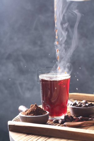 Photo for Coffee is a beverage prepared from roasted coffee beans. Darkly colored, bitter, and slightly acidic, coffee has a stimulating effect on humans, primarily due to its caffeine content. It has the highest sales in the world market for hot drinks. - Royalty Free Image