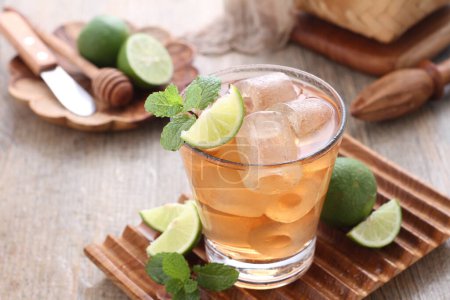 Photo for Fresh ice tea with lime and mint leaves - Royalty Free Image