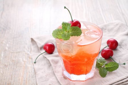 Photo for Fresh ice cherry garnished with cherry fruit and mint leaves - Royalty Free Image