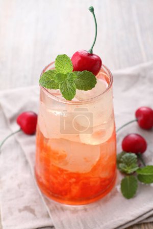 Photo for Fresh ice cherry garnished with cherry fruit and mint leaves - Royalty Free Image