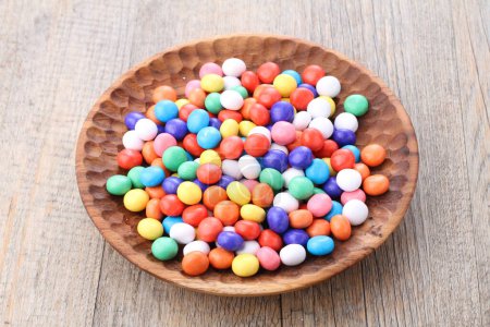 Photo for Colorful candies on wooden background - Royalty Free Image