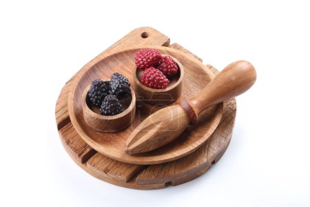 Photo for Fresh berries in wooden spoon on white background - Royalty Free Image