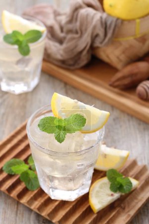 Photo for Lemon juice with mint leaf garnish - Royalty Free Image