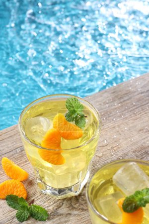 Photo for Ice oranges on the edge of the pool - Royalty Free Image
