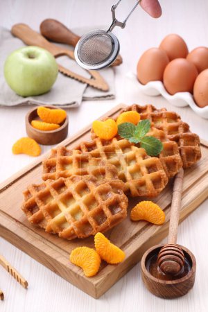 Photo for Waffles with chocolate and honey on a white background - Royalty Free Image