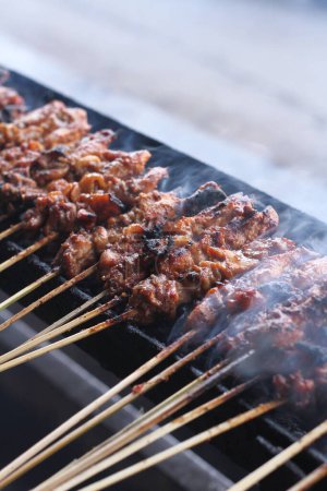 Photo for Grilled pork ribs on charcoal grill - Royalty Free Image