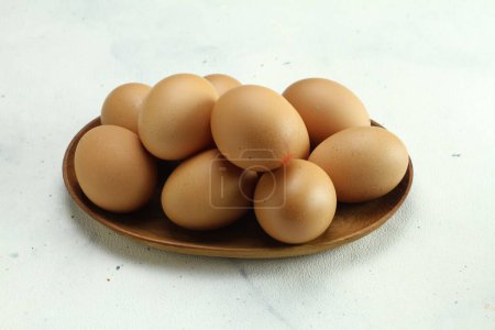 Photo for Eggs in a bowl on a white background - Royalty Free Image