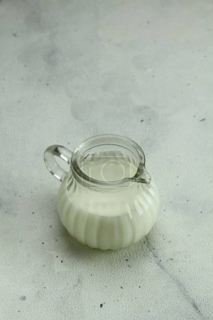 Photo for Glass jar with milk on a white background - Royalty Free Image