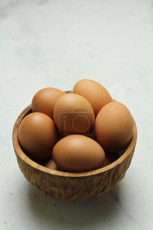 Photo for Eggs in a bowl on a white background - Royalty Free Image