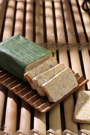 Photo for Close-up of a piece of soap with a bamboo mat - Royalty Free Image