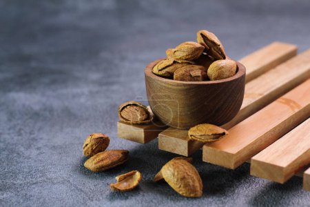 Photo for Nuts in wooden bowl - Royalty Free Image