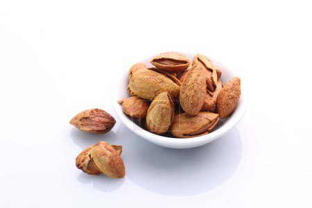 Photo for Almonds in a bowl on a white background - Royalty Free Image