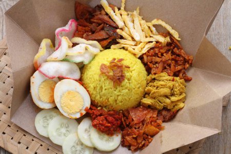Photo for Traditional indonesian food, indonesian traditional dish, fried rice, fried egg, fried egg with spices, chicken, vegetables and spices, and fried chicken - Royalty Free Image