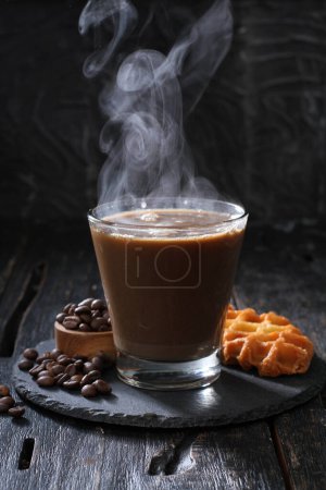 Photo for Coffee with chocolate and cinnamon on a dark background - Royalty Free Image