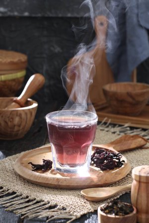 Téléchargez les photos : Black tea with a cup of coffee and a teapot on a wooden background. - en image libre de droit