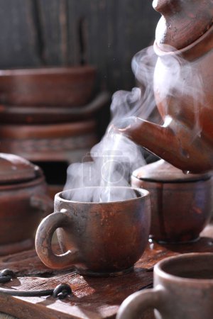Photo for Tea pot with hot water - Royalty Free Image