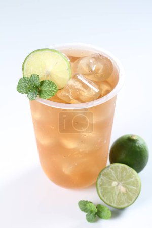 Photo for Iced tea with lime and mint on white background - Royalty Free Image