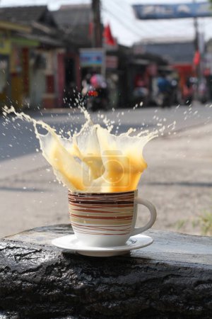 Photo for Coffee cup and hot milk on table - Royalty Free Image