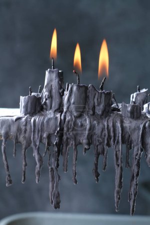 Photo for Burning black candle in the kitchen - Royalty Free Image