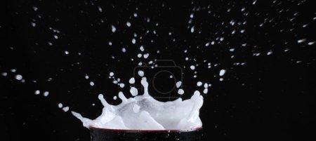 Photo for Splashing milk and ice. - Royalty Free Image