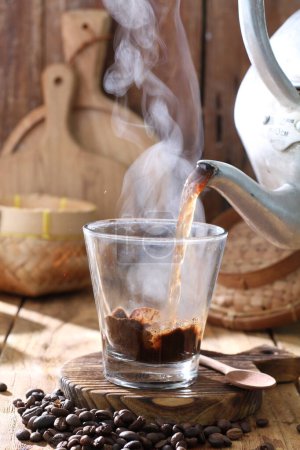 Photo for Coffee beans with smoke and cinnamon - Royalty Free Image