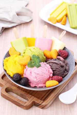 Photo for Mixed fruit cream ice cream with fruit, kiwi, kiwi, kiwi, mango, banana, blueberry, mango, kiwi, kiwi, mango, - Royalty Free Image