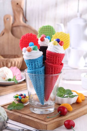 Photo for Delicious ice cream with waffle cones on table, closeup - Royalty Free Image