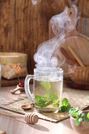 Photo for Hot tea with lemon and mint - Royalty Free Image