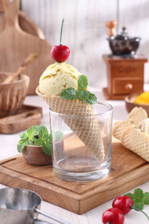 Photo for Delicious ice cream on wooden table - Royalty Free Image