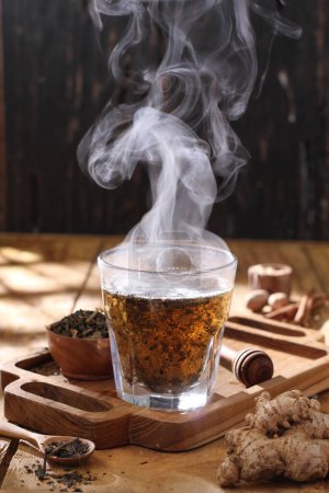 Photo for Cup with hot tea and spices - Royalty Free Image